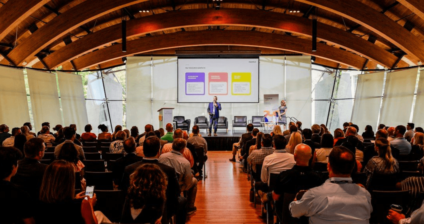 a man giving a presentation to a group of people